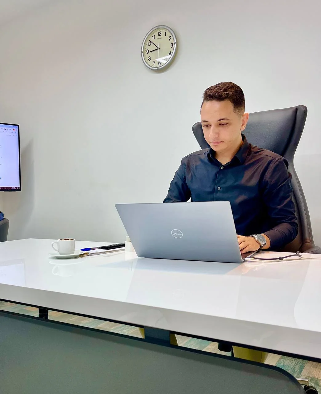 Ahmed Hegazy tourism web consultant working on a laptop